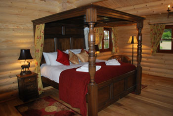 four poster bed in our romantic lodges