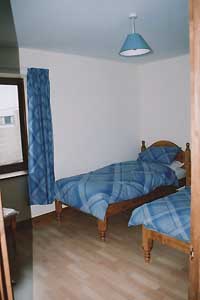One of two twin bedrooms - one blue, one pink
