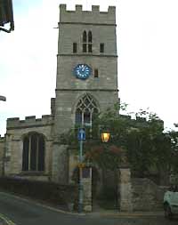 Stamford, Lincolnshire.  St. George's church is on a corner edged with large handsome houses. 