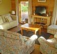 Open plan living area with kitchen and dining table