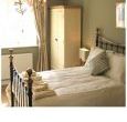Contemporary styling, flat screen TV and woodBurner