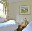 One of the two bedrooms in this lovely thatched cottage