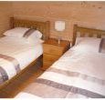 With two single beds, wardrobe and chest of drawers