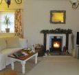 Comfortable sitting room with woodburner
