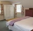 One of seven bedrooms in this large rural cottage