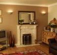 Luxury self-catering York: Sitting room with living flame fire and balcony