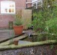 Luxury self-catering York: Designer garden with decking, patio and pond