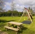 Large garden with childrens play equipment