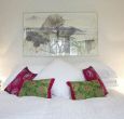 Beautiful linens and fabrics give the Orchard suite a touch of luxury
