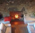 Comfortable sitting room with open fire and character