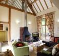 View of sitting room with patio and good views beyond