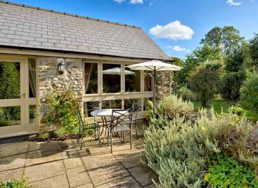 Set in beautiful gardens of listed mill