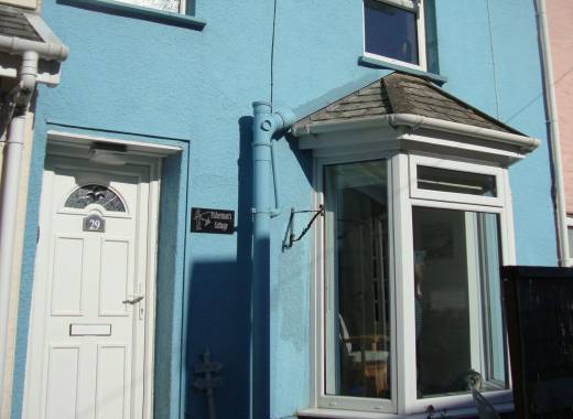 Cosy Fisherman's Cottage at Hele Bay, North Devon with its bay window overlooking the beach