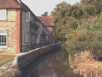 Visit Bosham for views of Chichester Harbour, a village church with crypt, crafts, tea shop, road that floods each tide.