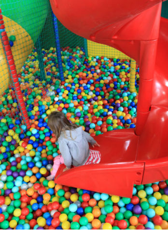 Child playing at soft-play centre
