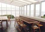 Conservatory has lovely views out over the sea and beach in this self-catering house in Kerry Ireland