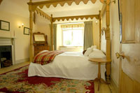 cottage with a four poster bed