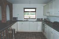 Fully fitted kitchen of this new barn conversion for summer 2003