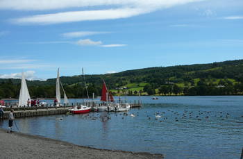 Enjoy boating, cycling or walking by Coniston Water in the Lake District National Park