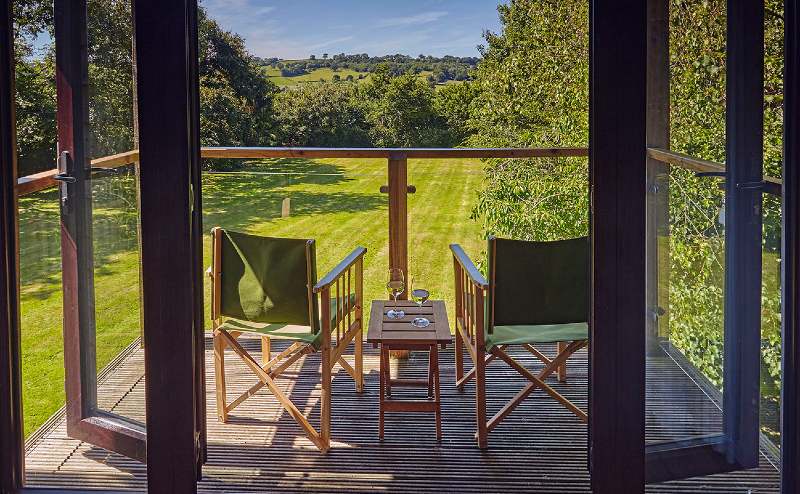 Cottage balcony with garden views