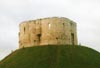 Visit Clifford's Tower near York's city walls, surrounded by geese