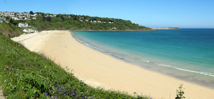 Golden sandy beach in Cornwall, perfect for relaxed summer holidays