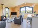 Open plan living area at Bacheiddon Log Cabin - thumbnail photo