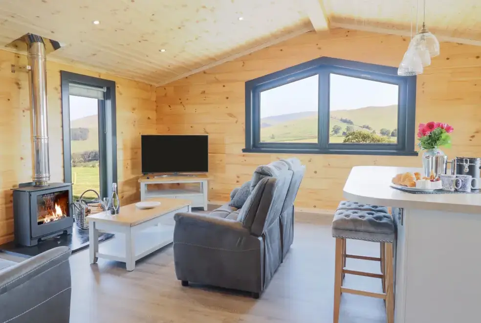 Open plan living area at Bacheiddon Log Cabin