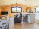 Open plan living area at Bacheiddon Log Cabin - thumbnail photo