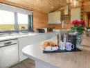 Kitchen/diner at Bacheiddon Log Cabin - thumbnail photo
