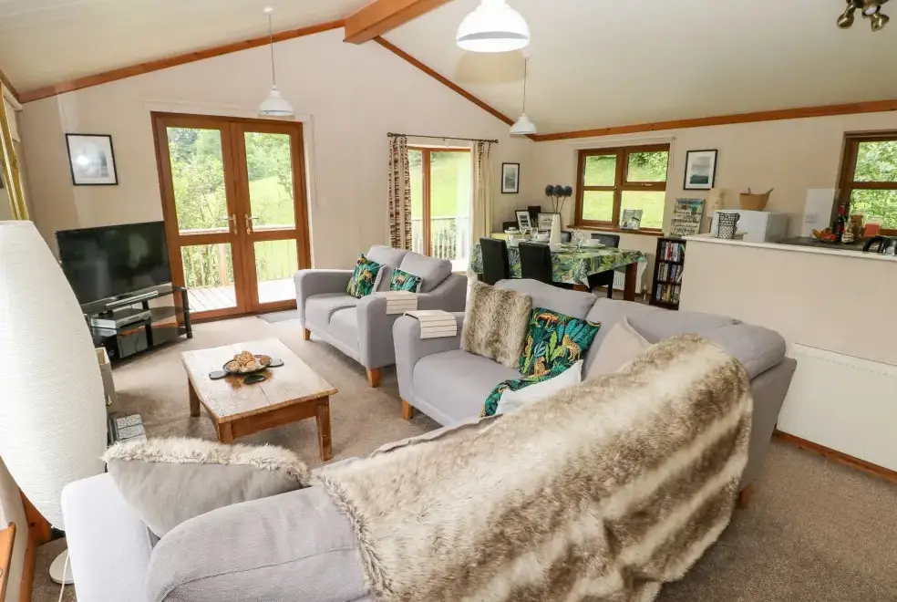 Open plan living area at Beeches Countryside Lodge, Wales