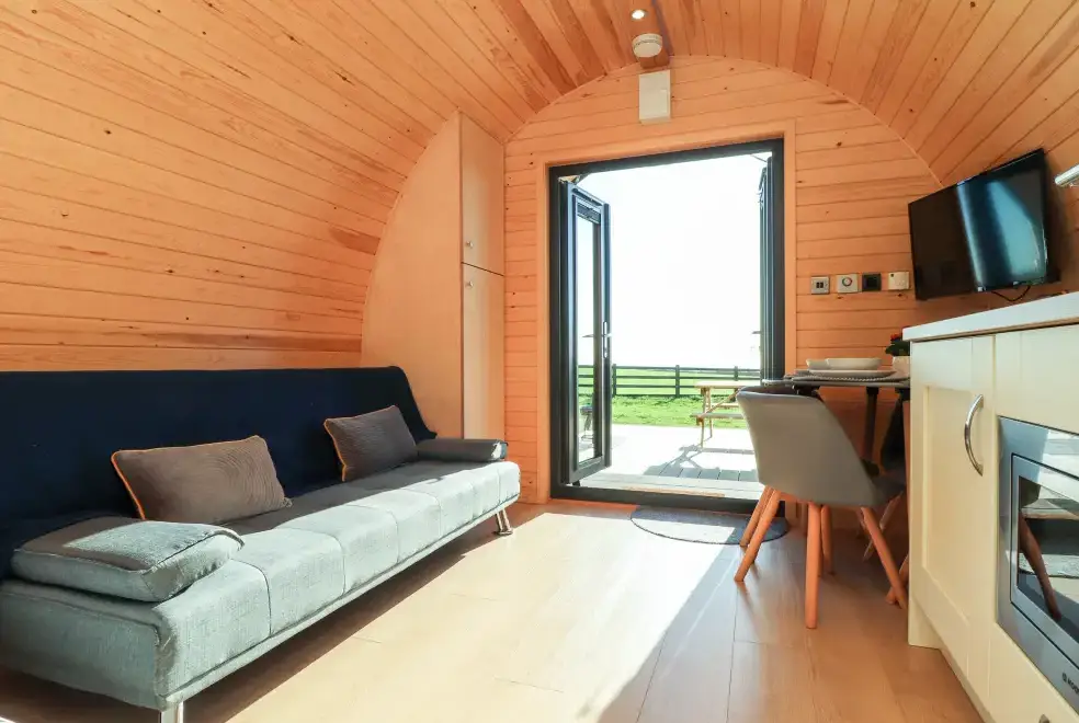 Open plan living area at Boskennal Farm Pod