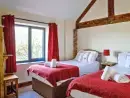 Bedroom at Buttercups 5 Star Cottage with Indoor Pool, Sports Court & Toddler Play Area - thumbnail photo