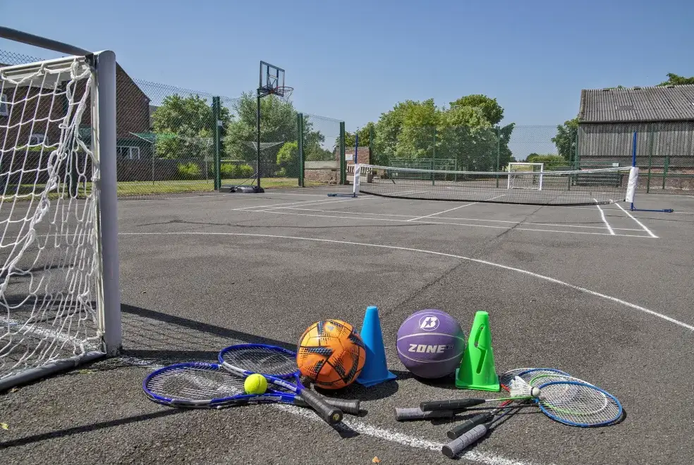 Outdoor games area at Buttercups 5 Star Cottage with Indoor Pool, Sports Court & Toddler Play Area