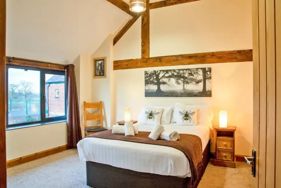 Bedroom at Buttercups Haybarn 5 Star Cottage with Indoor Pool, Sports Court & Toddler Play Area