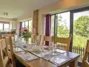 Kitchen/diner at Buttercups Haybarn 5 Star Cottage with Indoor Pool, Sports Court & Toddler Play Area - thumbnail photo