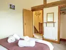 Bedroom at Buttercups Haybarn 5 Star Cottage with Indoor Pool, Sports Court & Toddler Play Area - thumbnail photo