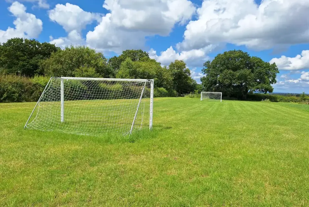 Outdoor games area at Buttercups Haybarn 5 Star Cottage with Indoor Pool, Sports Court & Toddler Play Area