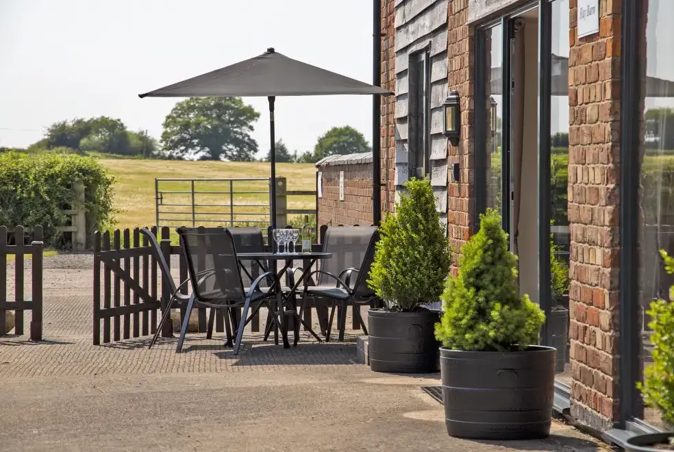Patio area at Buttercups Haybarn 5 Star Cottage with Indoor Pool, Sports Court & Toddler Play Area