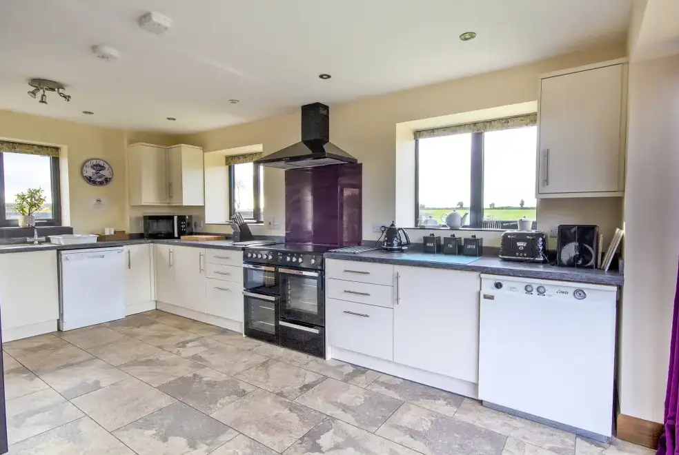 Well equipped kitchen at Buttercups & Hayloft Sleeps & Dines 16 with Pool, Sports Court & Play Area
