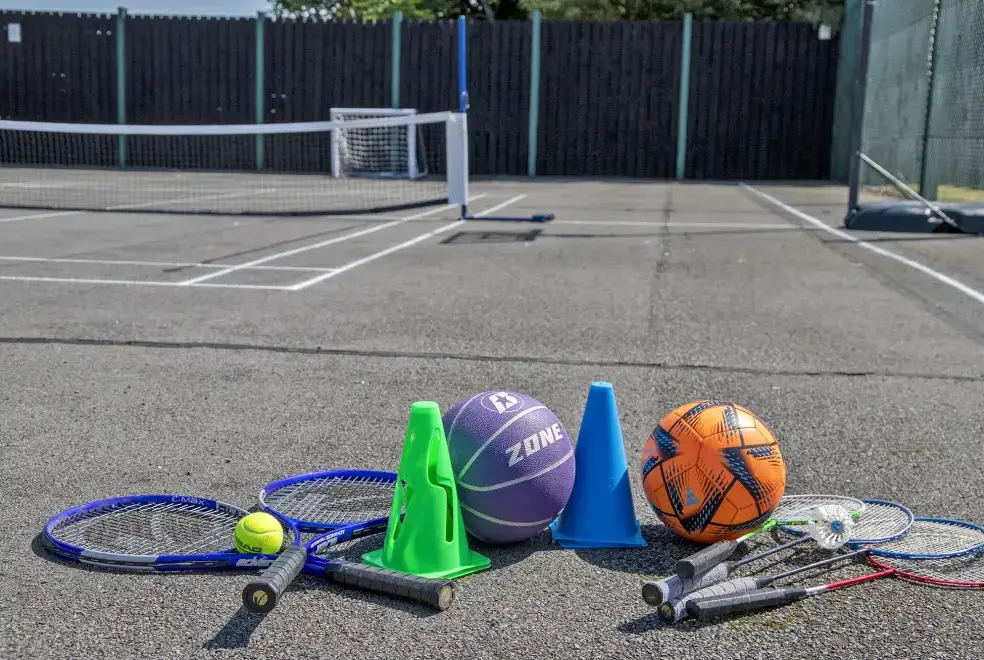 Outdoor games area at Buttercups & Hayloft Sleeps & Dines 16 with Pool, Sports Court & Play Area