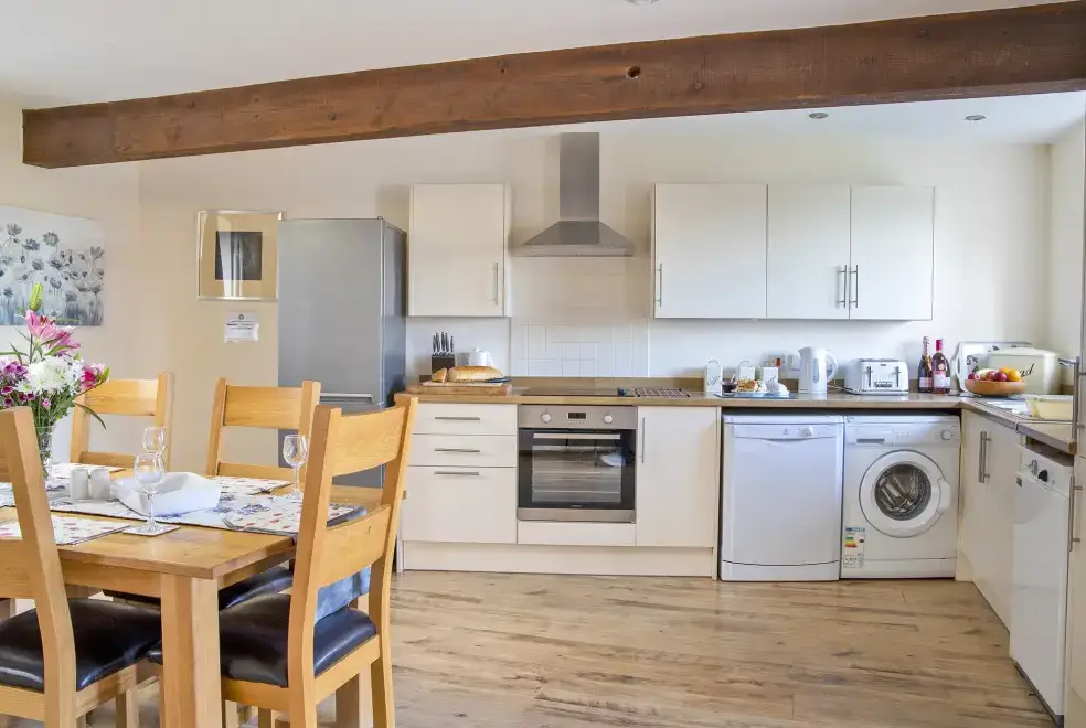 Kitchen/diner at Buttercups & Hayloft Sleeps & Dines 16 with Pool, Sports Court & Play Area