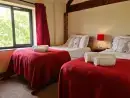Bedroom at Buttercups & Hayloft Sleeps & Dines 16 with Pool, Sports Court & Play Area - thumbnail photo