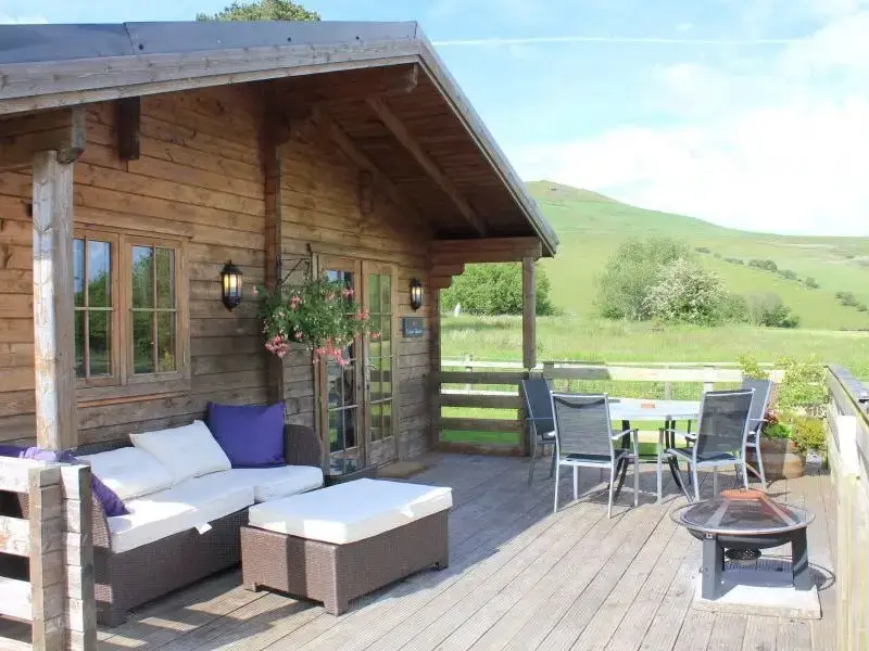 Decked area at Caban Iwrch with all weather Hot tub