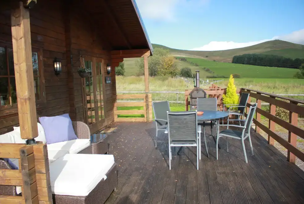 Decked area at Caban Iwrch with all weather Hot tub