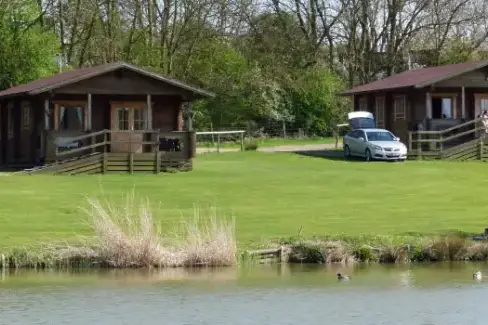 Cabins beside a fishing lake, Northamptonshire, Midlands