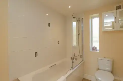 Family bathroom at Clock Tower Cottage, Wiltshire