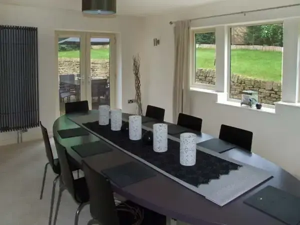 Dining room at Clouds Hill Holiday Home with Gym and Pool