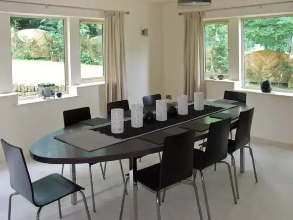 Dining room at Clouds Hill Holiday Home with Gym and Pool