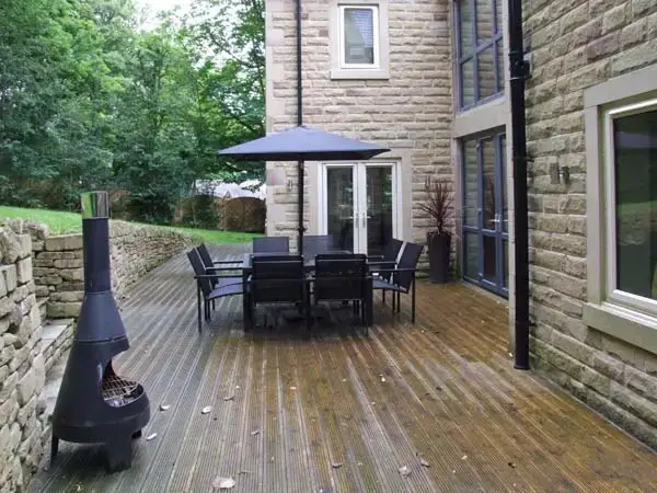 Decked area at Clouds Hill Holiday Home with Gym and Pool